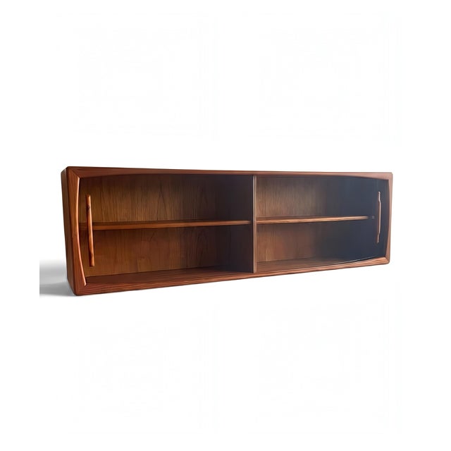 A danish modern vintage glass cabinet/wall shelf/hanging sideboard/glass display case, from the renowned furniture...