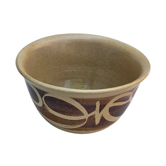 This vintage ceramic bowl showcases a rustic brown color and a charming handmade appeal. Crafted from ceramic stoneware,...