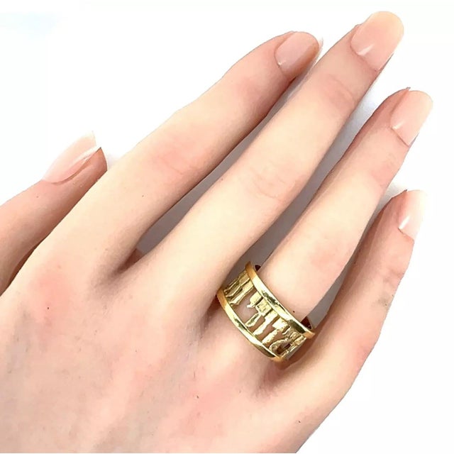 This is a Jewish designed wedding band ring, it is crafted from 14k yellow gold with a polished and textured finish and...