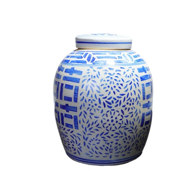 Tall 10” porcelain chinoiserie ginger jar featuring a crisp cobalt geometric stylized lattice and double happiness...