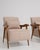Rendered in the refined idiom of Mid-Century Modernism, this distinguished pair of French armchairs embodies the era's...