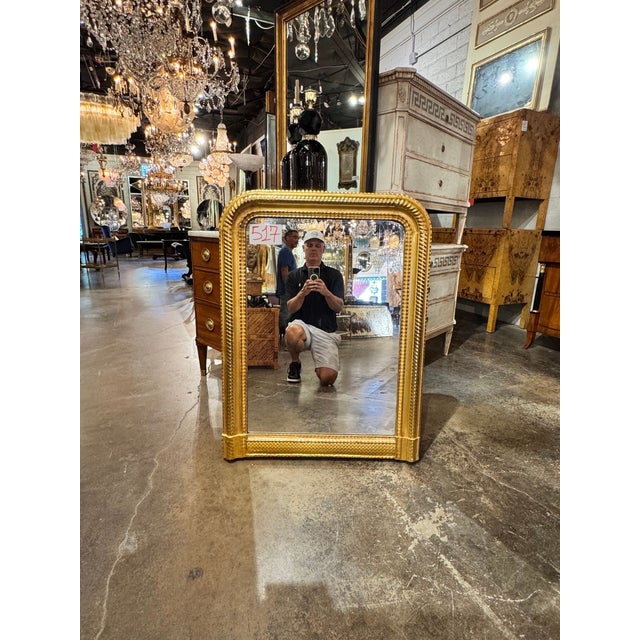This 19th century French Louis Philippe water gilded mirror is a stunning antique piece that would make a sophisticated...