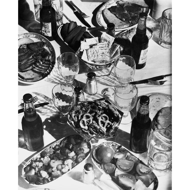 Snack Food Bottles of beer, salad, crackers and salted pretzels at a party, circa 1940. (Photo by George...