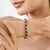 This statement tennis bracelet is crafted in 925 sterling silver and features 26.55 carats of natural red garnet in...