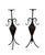 A sculptural pair of Mediterranean-style floor candleholders featuring hand-forged style wrought iron frames and woven...