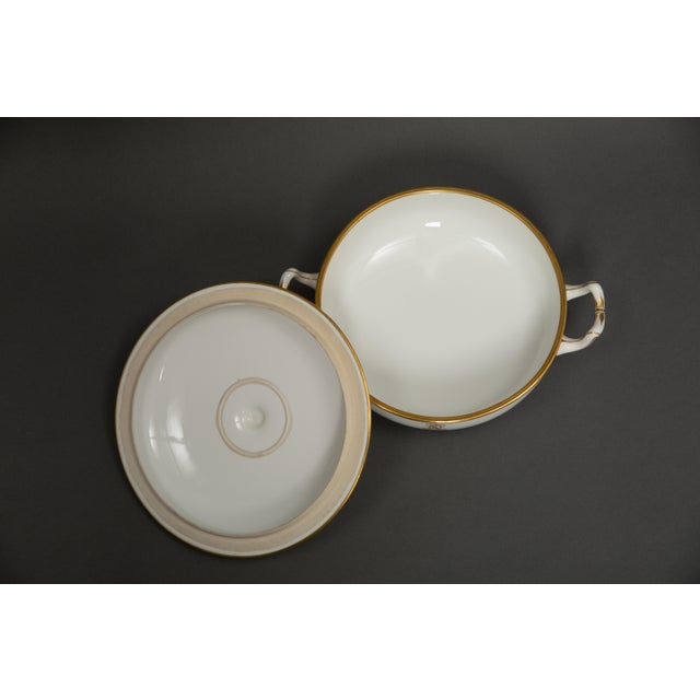 An elegant white porcelain tureen produced by the Sèvres Manufactory in the late 19th century. This refined piece is...