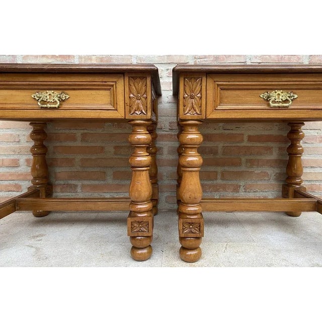 20th century pair of Spanish nightstands in solid walnut with one drawer, bronze hardware and round carved legs. Beautiful...