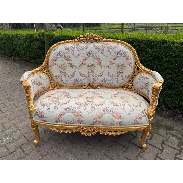 A refined 1970 French Louis XVI–style gilt beech damask sofa set, consisting of one corbeille settee and two matching...