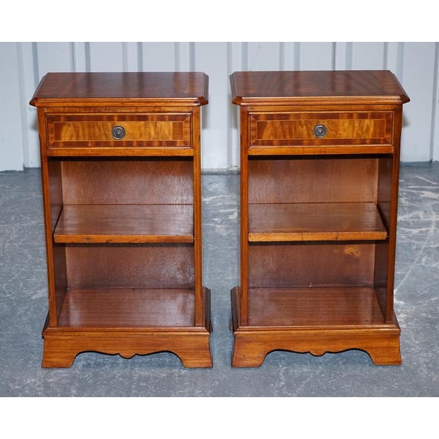 This elegant pair of bedside tables is crafted in the Georgian style, featuring refined proportions and timeless design....