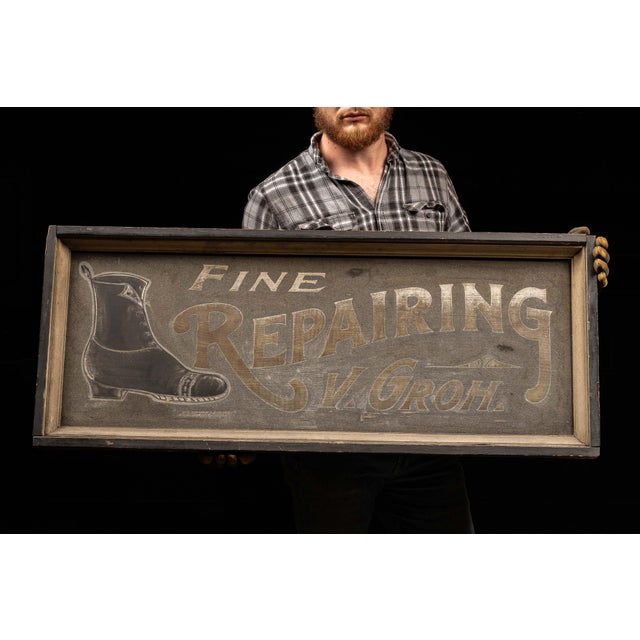 Antique storefront sign for a shoe repair business. This sign features a painted smaltz background with stenciled...