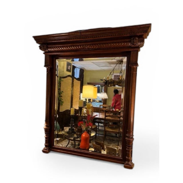A commanding late 19th century Renaissance Revival architectural mirror crafted in richly toned walnut. Standing an...