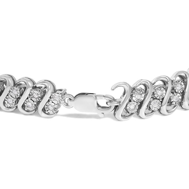 Shimmer and shine with this pleasing diamond link bracelet. Crafted from cool weaves of sterling silver, this mesmerizing...