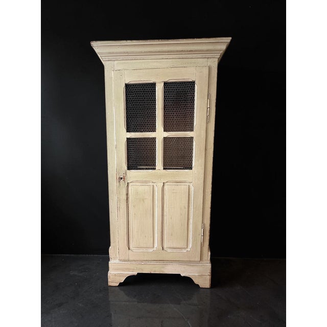 An exceptional French late 19th-century country-style bonnetière (single-door wardrobe) beautifully adapted into a high-...