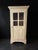 An exceptional French late 19th-century country-style bonnetière (single-door wardrobe) beautifully adapted into a high-...