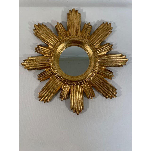 A stunning 14" Italian Giltwood Sunburst Wall Mirror from the 1960s. Made in the Florentine region of Italy. Retains...