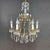 A gilded iron and blue crystal chandelier dating back to 1950, featuring an elegant and romantic design. This six-light...