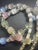 1930s Art Deco Multi Layer Pastel Colored Satin Glass Necklace With Ornate Sterling Silver Push Clasp Art. For Sale - Image 4 of 6