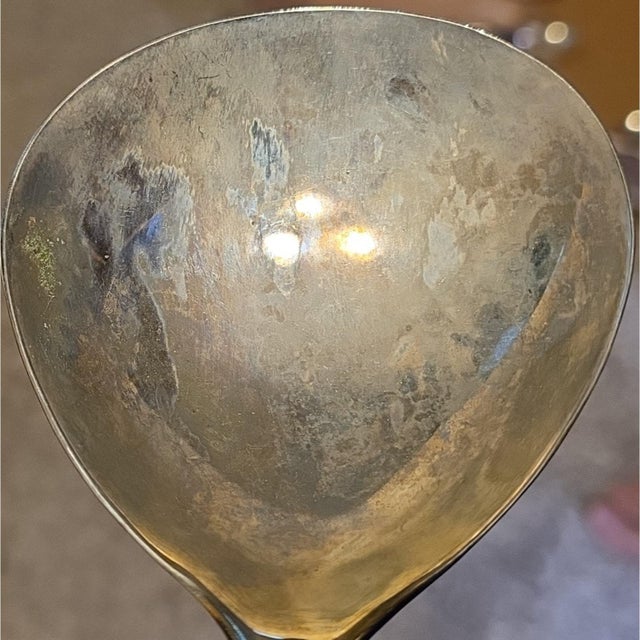 International Silver Company vintage gravy ladle measuring 11.5 inches, featuring a silver-plated finish with a gold tone...