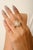 Art Deco Pear Zircon Bold Statement Ring by Carat&her – This elegant ring features a stunning 12x8 mm pear-cut cubic...