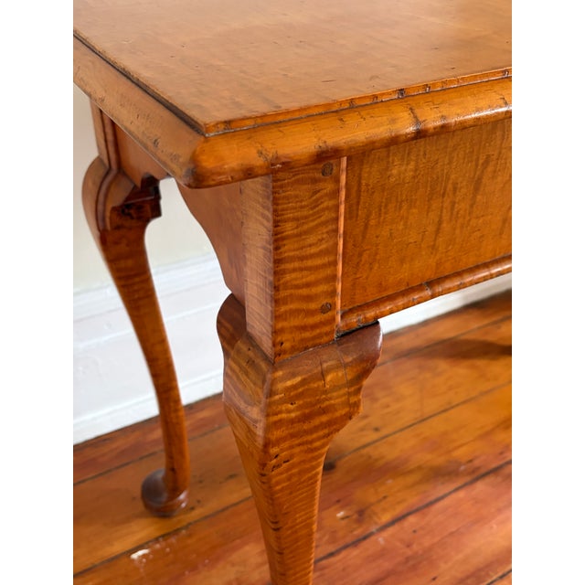 Late 18th century tiger maple console. This Massachusetts constructed piece is of fine elegant period lines exemplifying...