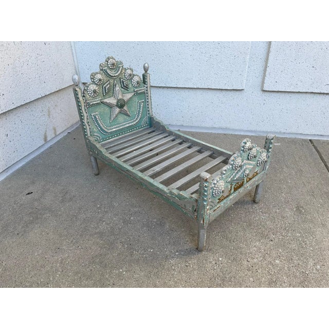 Rare, cool and unusual tramp art dog bed with chip carved decoration and blue and silver paint. The head board wonderfully...
