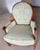 This chair displays a classic Louis XVI style, as evident in its elegant lines, oval backrest, and carved details on the...