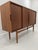 Super elegant 60s sideboard / highboard. High quality workmanship, veneered in teak. with 4 sliding doors. Inner life...