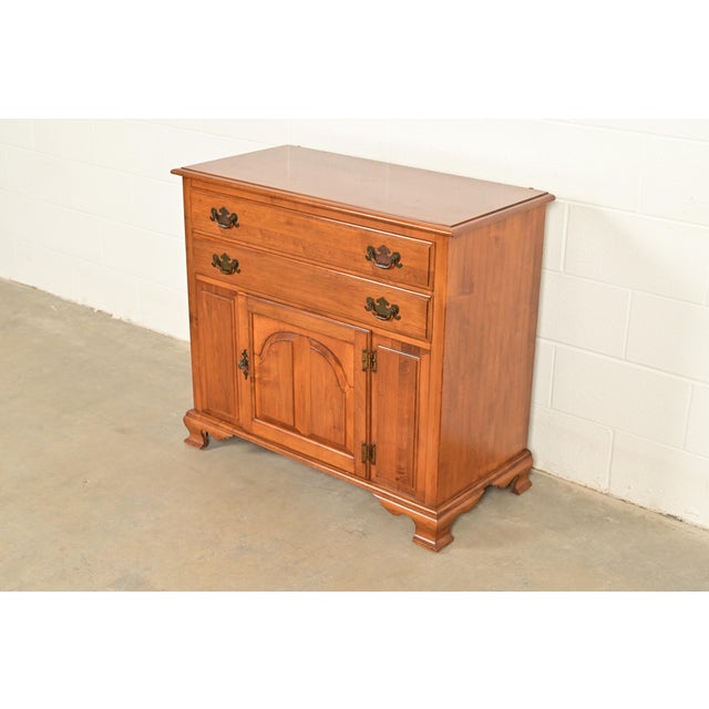 A gorgeous American Colonial or Chippendale style buffet server or bar cabinet By Kling Furniture Co. USA, Circa 1960s...