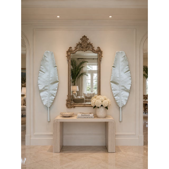 A striking and highly decorative pair of monumental banana leaf wall sculptures, made and designed by Julio Jimenez,...