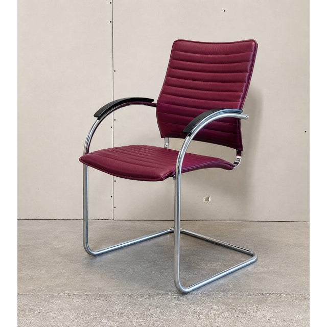 The leather is finished in a Bordeaux purple hue. The seats and backrests are upholstered with padding, designed to...