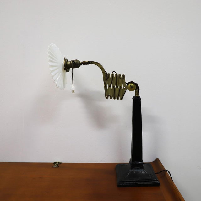 Circa 1920. We offer this Rare Industrial Scissor Table Lamp fully electrified.
