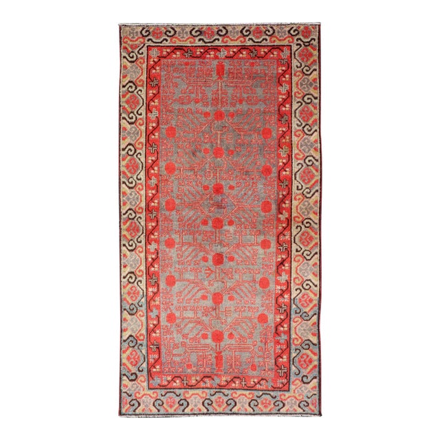 Ntricate Vintage Khotan Rug With Sub-Geometric Design in Reds and Light Blue For Sale