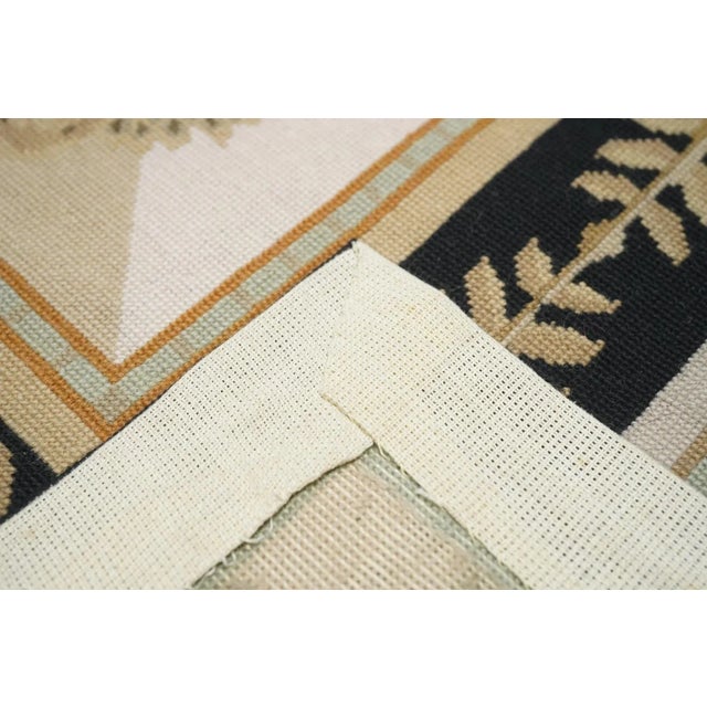 Usually English or French, often with repeating allover designs executed with wool cross-stitches. Larger carpets are...
