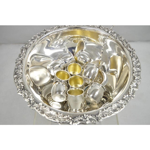 Vintage FB Rogers Silver Plated Victorian Style Punch Bowl Set w/ 10 Cups and Ladle. Circa Mid 20th Century. Measurements:...