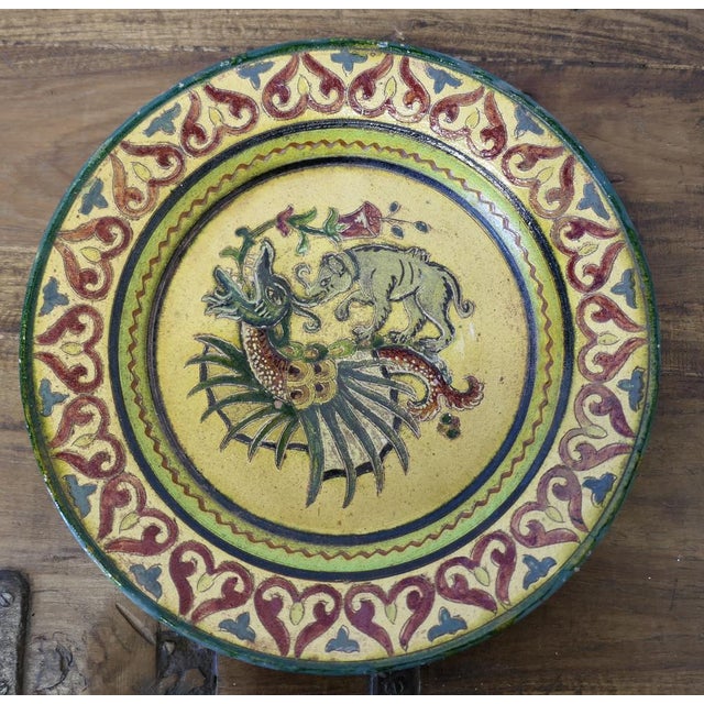 Montopolyi Arno Italian Plate with Dragon and Bear An unusual piece made in terracotta marked Montopolyi Arno, the plate...