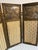 This is a petite antique French folding screen in a Louis XVI style from the 1900's — three hinged giltwood leaves, each...