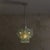 An Italian glass and chrome pendant crafted in the 1970s. The slender, irregular glass elements descend in layered tiers,...