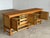 Danish Brutalist low sideboard designed by Henning Kjærnulf for Nyrup Møbelfabrik, Denmark, 1960s. Crafted in solid oak,...