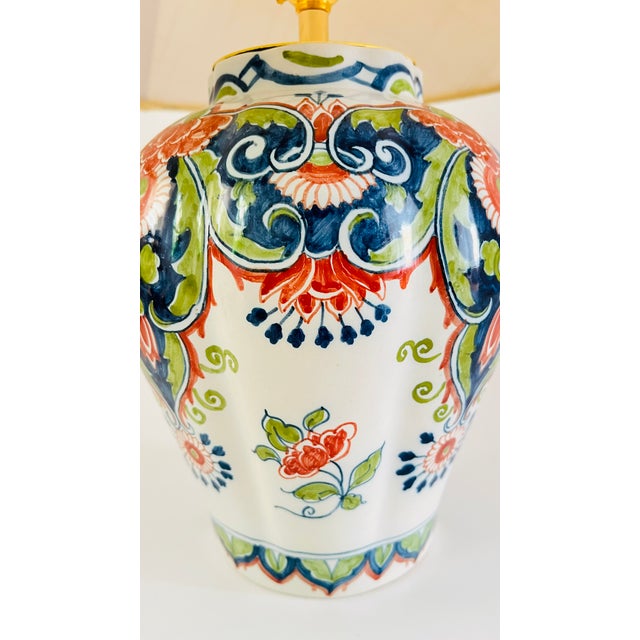 An early 20th century table lamp made from a rare antique baluster vase by royal tichelaar makkum. Decorated on an off...