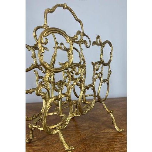 Elegant Vintage Brass Newspaper Rack This decorative Vintage brass newspaper rack features an intricate French-inspired...