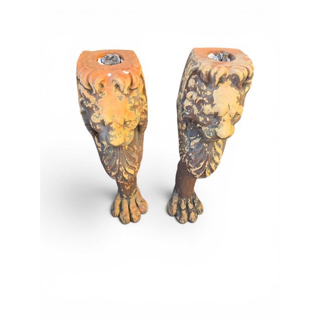 Rare and impressive pair of large Greco-Roman style terracotta pedestals modeled as lion paws, dating from the 19th...