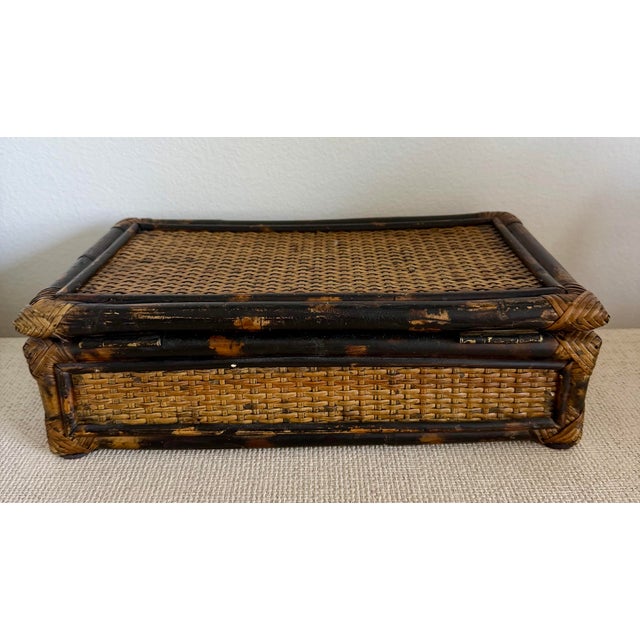 Vintage burnt woven bamboo rattan lidded box with detailed faux tortoise bamboo. Two small compartments and one large spot...
