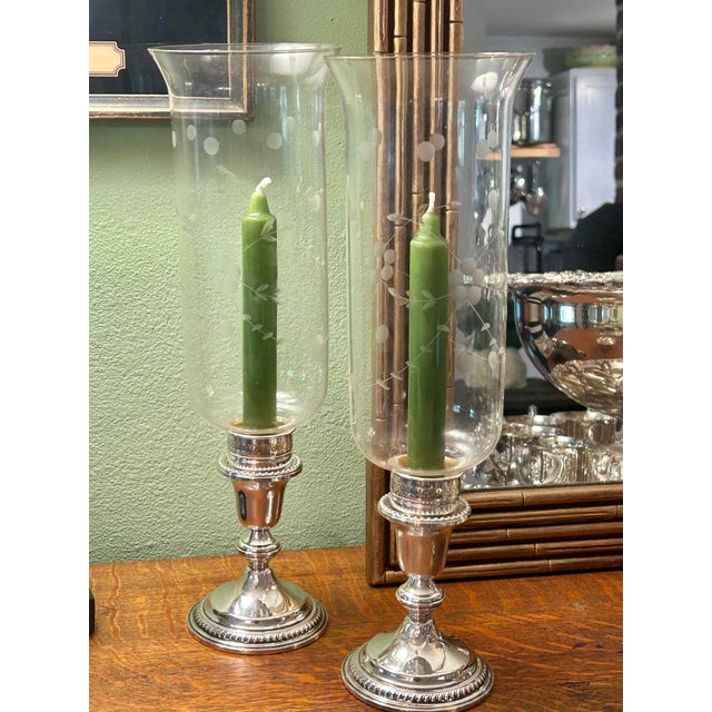 This pair of vintage sterling silver hurricane candleholders is by Garden Silversmiths Ltd., New York, circa 1960s–1970s....