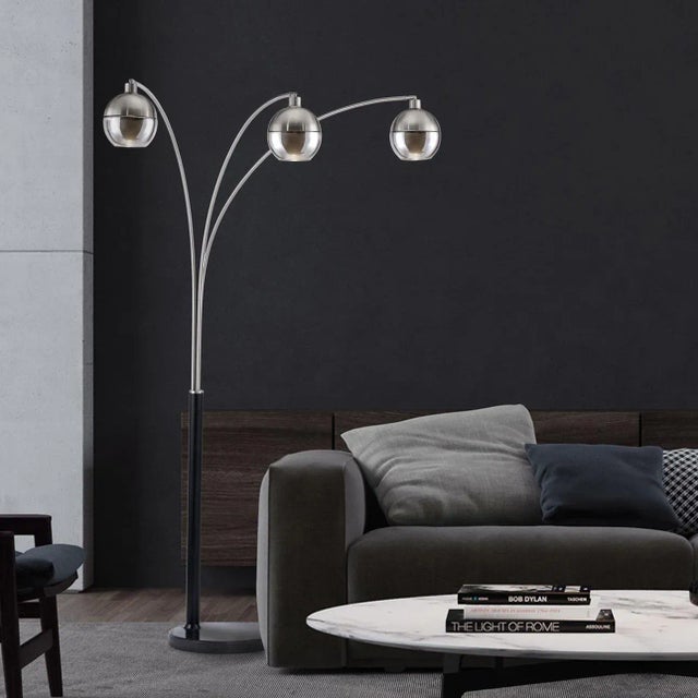The Orson 3-Light Arc Floor Lamp offers a large-scale statement piece that bathes any room in a soothing, diffused glow....