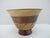 Beautifully hand made segmented wooden bowl, constructed from multiple stacked rings of different light and dark tone...