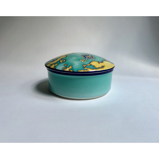Tiffany & Co. Porcelain "World Discovery" two piece Trinket Box designed for Tauck Tours, 2000. Featuring a circular...
