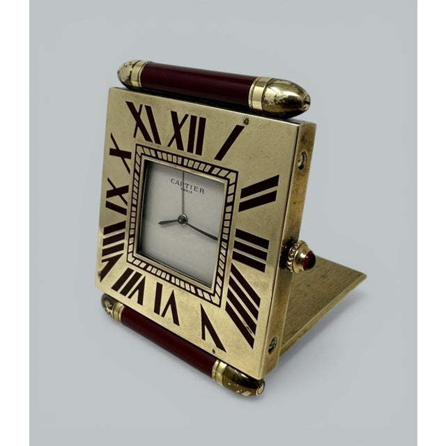 A very stylish vintage Cartier ladies or gentleman’s folding gold-plated quadrant travelling alarm clock by famous jeweler...