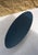 Oval coffee table Petrol blue lacquered MDF top, multicolored edges. Chrome-plated steel wire base.