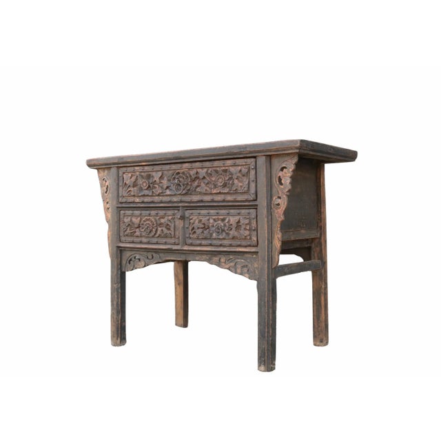 This early 19 century antique Chinese 3 drawers chest showcases exquisite hand carved drawer fronts and sides. Dark brown...