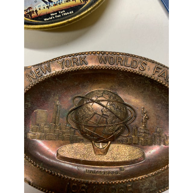 Instant World's Fair collection from 1964 New York. Two ashtrays and a spoon from the Illinois Land of Lincoln pavilion...